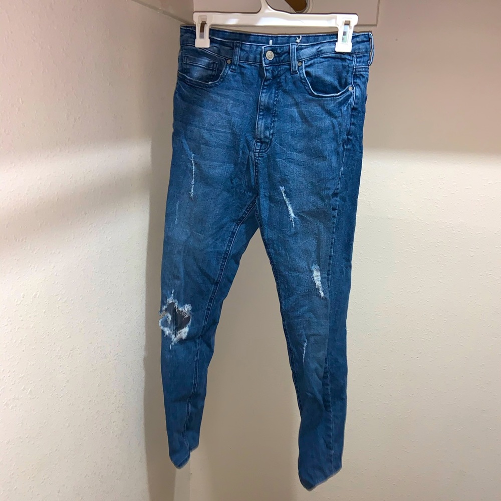 Blue ripped jeans.